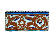 Polychrome Tile with Scroll Design on Cobalt Red Ground