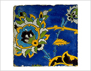 Polychrome Tile with Design of Flower and Scroll on Cobalt Blue