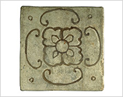 Tile with Carved Flower Design and Ash Glaze