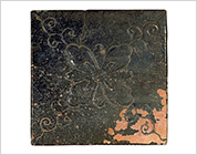 Tile with Carved Flower Design and Iron Glaze