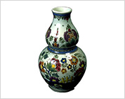 Gourd-Shaped Vase Painted in Blue, Red, Yellow and Green with Flower and Bird Design (Delft Ware Faience)