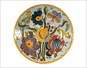 Plate Painted with Flower and Butterfly in Multicolour Enamels (Delft Ware Faience)