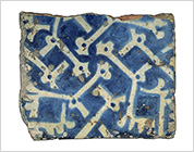 Tile with Geometric Pattern in White on Blue Design of Interlace