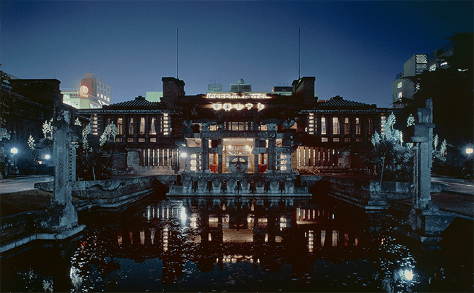 An evening view of the grand entrance of Wright's Imperial Hotel.