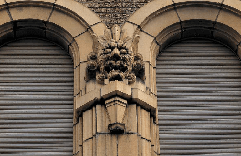 A terracotta ornament of Oni (demons) produced by Ina Seito (INAX), adorning the wall of the former headquarters of Dainippon Pharmaceutical, built in 1930. In Japan, Oni  were thought to ward off evil spirit and protect those inside.