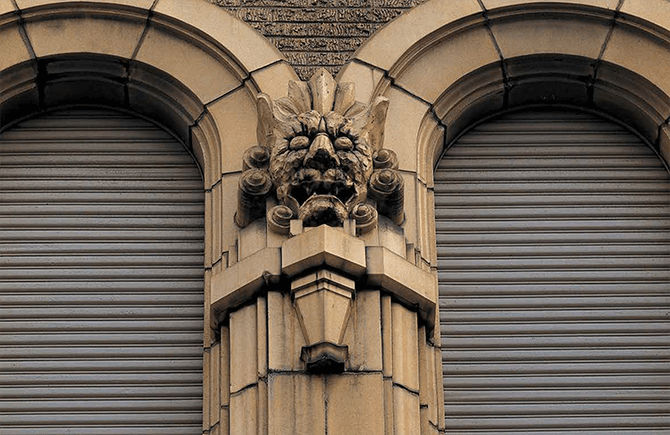 A terracotta ornament of Oni (demons) produced by Ina Seito (INAX), adorning the wall of the former headquarters of Dainippon Pharmaceutical, built in 1930. In Japan, Oni  were thought to ward off evil spirit and protect those inside.